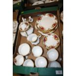 A TRAY OF ROYAL ALBERT OLD COUNTRY ROSES CHINA TO INCLUDE A TEAPOT, CUPS AND SAUCERS ETC.