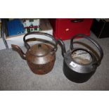 TWO VINTAGE CAST METAL KETTLES