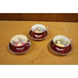 THREE PARAGON CHINA CUPS AND SAUCERS WITH INTERIOR FRUIT PATTERN