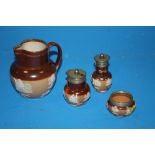 A ROYAL DOULTON LAMBETH THREE PIECE CRUET SET TOGETHER WITH A JUG