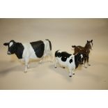 A LARGE BESWICK MATTE FINISH HEREFORD BULLFIGURE, TOGETHER WITH A GLOSS FINISH HEREFORD COW FIGURE