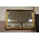 A GILT FRAMED BEVEL EDGED WALL MIRROR