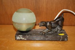 AN ART DECO STYLE MARBLE BASED TABLE LAMP WITH DOG FINIAL AND GREEN GLASS SHADE