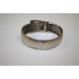 AN ANTIQUE ENGRAVED STERLING SILVER BANGLE