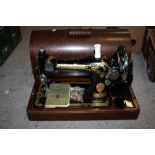 A MAHOGANY CASED VINTAGE SINGER SEWING MACHINE