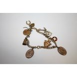 A VINTAGE CHARM BRACELET WITH 9 CARAT GOLD AND YELLOW METAL CHARMS