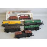 A BOXED O GAUGE LMS STEAM LOCOMOTIVE AND TENDER; together with five unboxed pieces of rolling stock,