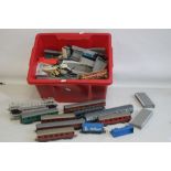 A LARGE QUANTITY OF HORNBY TRAIN PLATFORM AND SEVENTEEN CARRIAGES/ ROLLING STOCK,in several scales