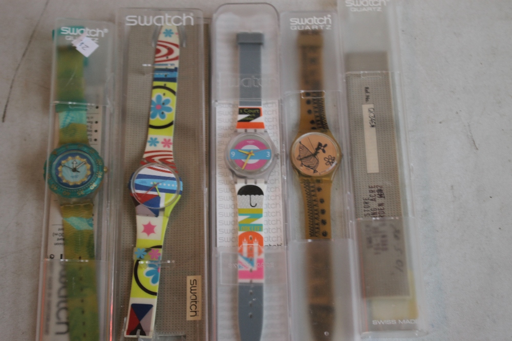 FOUR VINTAGE SWATCH WATCHES, together with various Swatch boxes