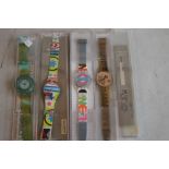 FOUR VINTAGE SWATCH WATCHES, together with various Swatch boxes