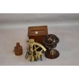 A REPRODUCTION BRASS SEXTANT, ALONG WITH A MINIATURE ZODIAC GLOBE, wooden tape measure & cigarette