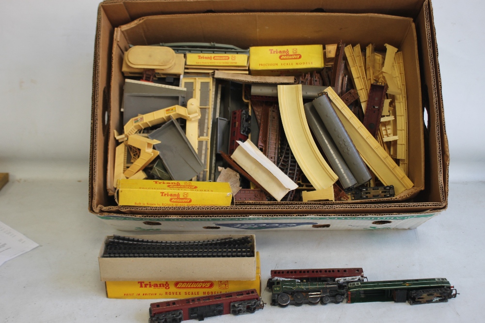 A BOX CONTAINING TRIANG TT SCALE, LOCOMOTIVES with carriages, track, platforms etc.