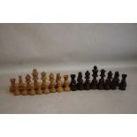 A WEIGHTED WOODEN CHESS SET IN WOODEN BOX