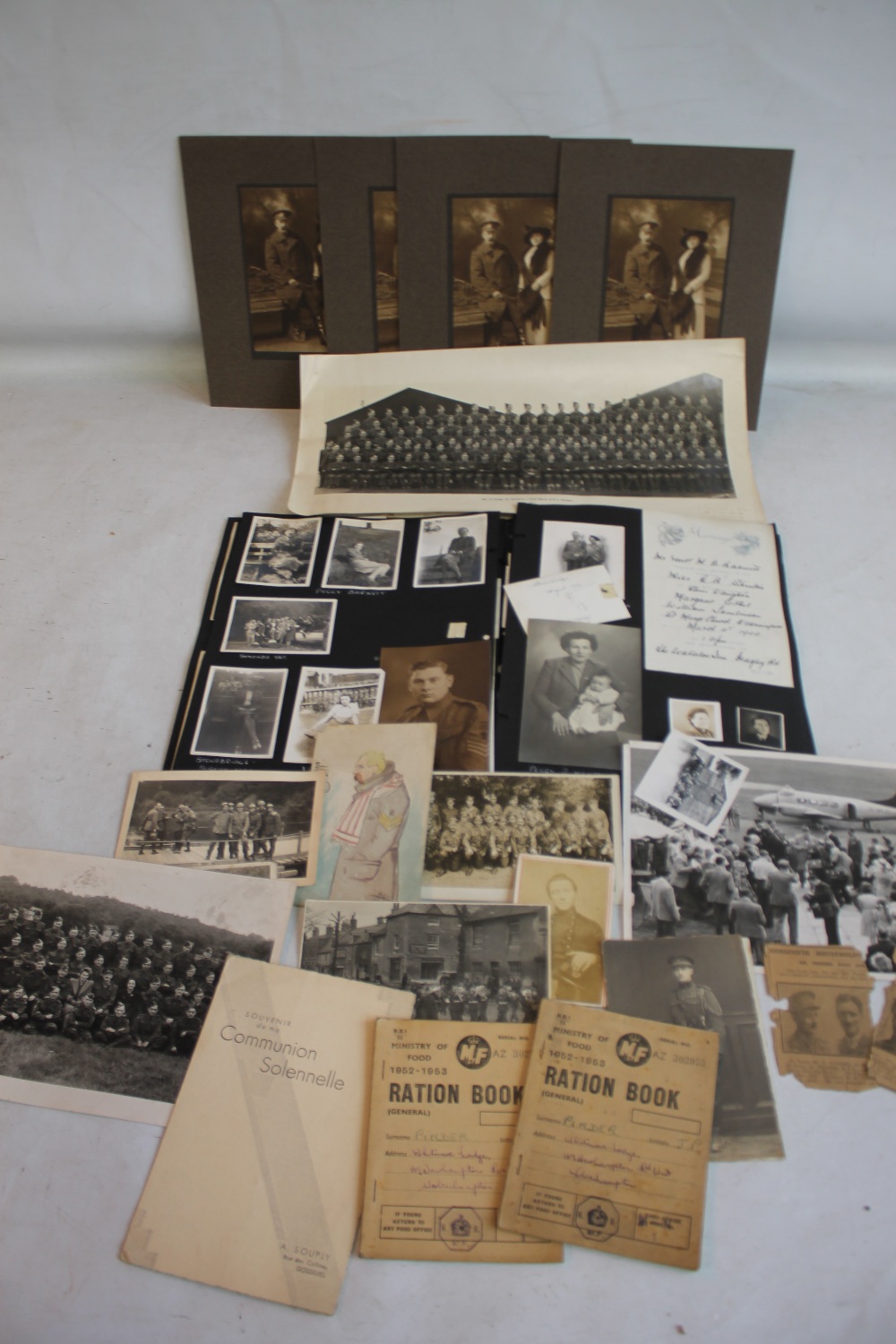 A COLLECTION OF WWI AND WWII MILITARY INTEREST PHOTOGRAPHS, POSTCARDS AND RATION BOOKS ETC, also