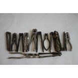 A COLLECTION OF ANTIQUE NUT CRACKERS, to include a pair with Lincoln Imp design