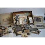 A BOX OF EARLY-MID 20TH CENTURY PHOTOGRAPHS, mainly of people to include an album of postcard types