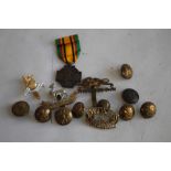 A BELGIUM MILITARY COMBATANTS CROSS MEDAL 1940-45 and a quantity of military badges and buttons.