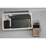 A BOXED SINCLAIR ZX SPECTRUM PERSONAL COMPUTER, together with a boxed vintage Rockwell Calculator