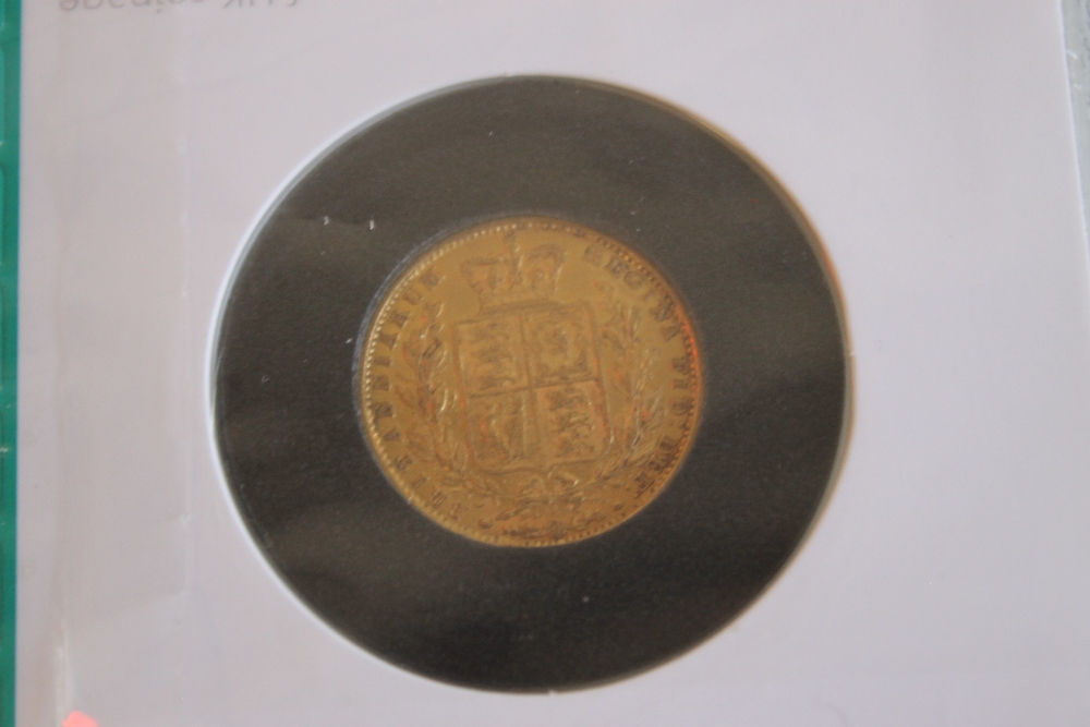 A VICTORIAN 1854 SHIELD BACK SOVEREIGN IN ROYAL MINT COLLECTORS SERVICES PACKET.