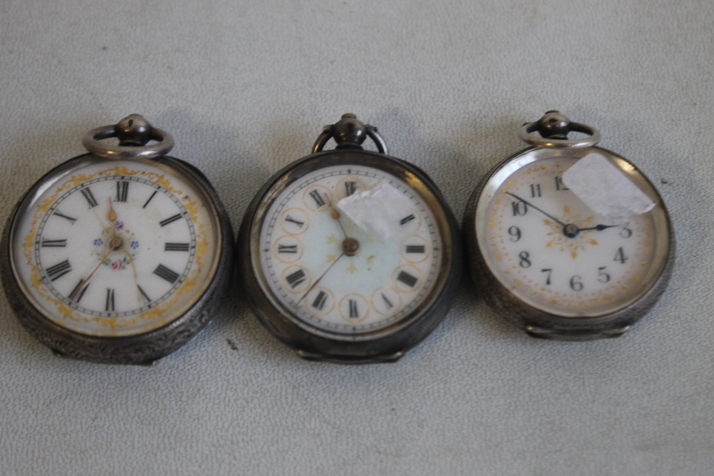 THREE 19TH CENTURY CONTINENTAL WHITE METAL FOB WATCHES WITH FANCY ENAMEL DIALS