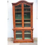 A QUALITY VICTORIAN MAHOGANY GLAZED BOOKCASE, the arched top above two shaped glazed doors, the