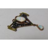 AN ARTS AND CRAFTS COPPER AND ENAMEL PENDANT, set with central oval opal and opal dropper, H 4.2 cm.