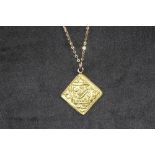 A MIDDLE EASTERN TYPE HIGH CARAT GOLD SQUARE PENDANT, on later attached 9 ct gold suspension ring