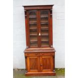A 19TH CENTURY MAHOGANY GLAZED FLOORSTANDING BOOKCASE OF SLIM PROPORTIONS, the glazed, twin door