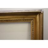 AN 18TH CENTURY GOLD FRAME WITH DECORATIVE DESIGN TO INNER EDGE, frame W 9 cm, frame rebate 77 x