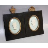 A PAIR OF 20TH CENTURY OVAL MINIATURE FRAMED PLASTER PROFILES IN RELIEF DEPICTING HER MAJESTY
