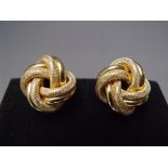 A PAIR OF 14K GOLD CLIP ON EARRINGS, in the form of a knot, marked to clip 14K, MILOR, Italy, approx