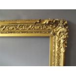 A 19TH CENTURY DECORATIVE GOLD FRAME WITH CORNER EMBELLISHMENTS, frame W 9 cm, frame rebate 72 x