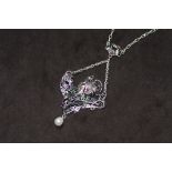 A SILVER PLIQUE A JOUR GYPSY / EXOTIC DANCER NECKLACE, set with a suspended pearl, rubies, amethysts
