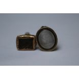 AN ANTIQUE BRASS FOB SET WITH A ROCK CRYSTAL INTAGLIO DEPICTING THE FIGURE EQUITY, 2 x 1.5 cm,