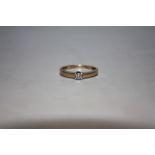 A 9 CARAT GOLD DIAMOND SOLITAIRE RING, ring size O 1/2