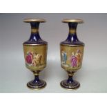 A PAIR OF ROYAL VIENNA GILDED PORCELAIN VASES, signature to bottom edge of figural central band,