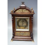 AN EARLY 20TH CENTURY OAK CASED MANTEL CLOCK BY LENZKIRCH, the architectural case with decorative