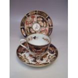 A ROYAL CROWN DERBY COFFEE CAN AND SAUCER, pattern no. 2451, together with a shaped dish (3)