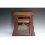 AN ARTS AND CRAFTS STYLE TOBACCO CABINET, H 34 cm