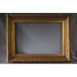 A 19TH CENTURY DECORATIVE GILT FRAME WITH ACANTHUS LEAF DESIGN TO OUTER EDGE, frame W 15 cm, frame