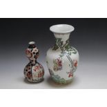 A CHINESE VASE FEATURING CHILDREN PLAYING, H 26 cm, together with a small Japanese Imari style