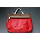 A FURLA SATCHEL STYLE HANDBAG WITH ADDITIONAL SHOULDER STRAP, red leather with cream and brown