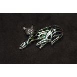 A SILVER PLIQUE A JOUR CAT BROOCH / PENDANT, set with ruby eyes