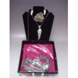 A SELECTION OF BUTLER AND WILSON FASHION JEWELLERY, to include a gold plated flower brooch with