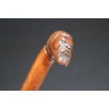 A CARVED WALKING STICK WITH BEARDED MAN HANDLE, L 81 cmCondition Report:some splits to main shaft