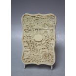A 19TH CENTURY CARVED ORIENTAL IVORY CARD CASE, one side typically carved with figures and