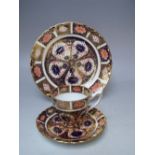 A ROYAL CROWN DERBY COFFEE CAN AND SAUCER, pattern no. 9310, together with a side plate - Dia. 18 cm