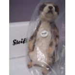 A STEIFF 'MUNGO' MEERKAT TEDDY BEAR, EAN 071249, H 30 cm, in sealed, unopened packaging, boxed.