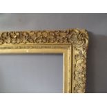 A 19TH CENTURY DECORATIVE GOLD FRAME WITH GOLD SLIP, frame W 5 cm, frame rebate 61 x 45 cm, slip