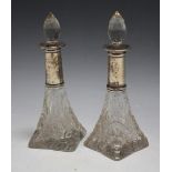 A PAIR OF HALLMARKED SILVER COLLARED SCENT BOTTLES - LONDON 1912, H 15.5 cm (2)